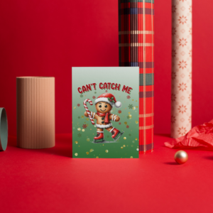 A cute gingerbread man ice skating with a candy cane holiday greeting card. Card is sitting in front of Christmas wrapping paper.