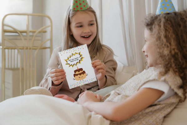 Girl holding up birthday cake birthday card